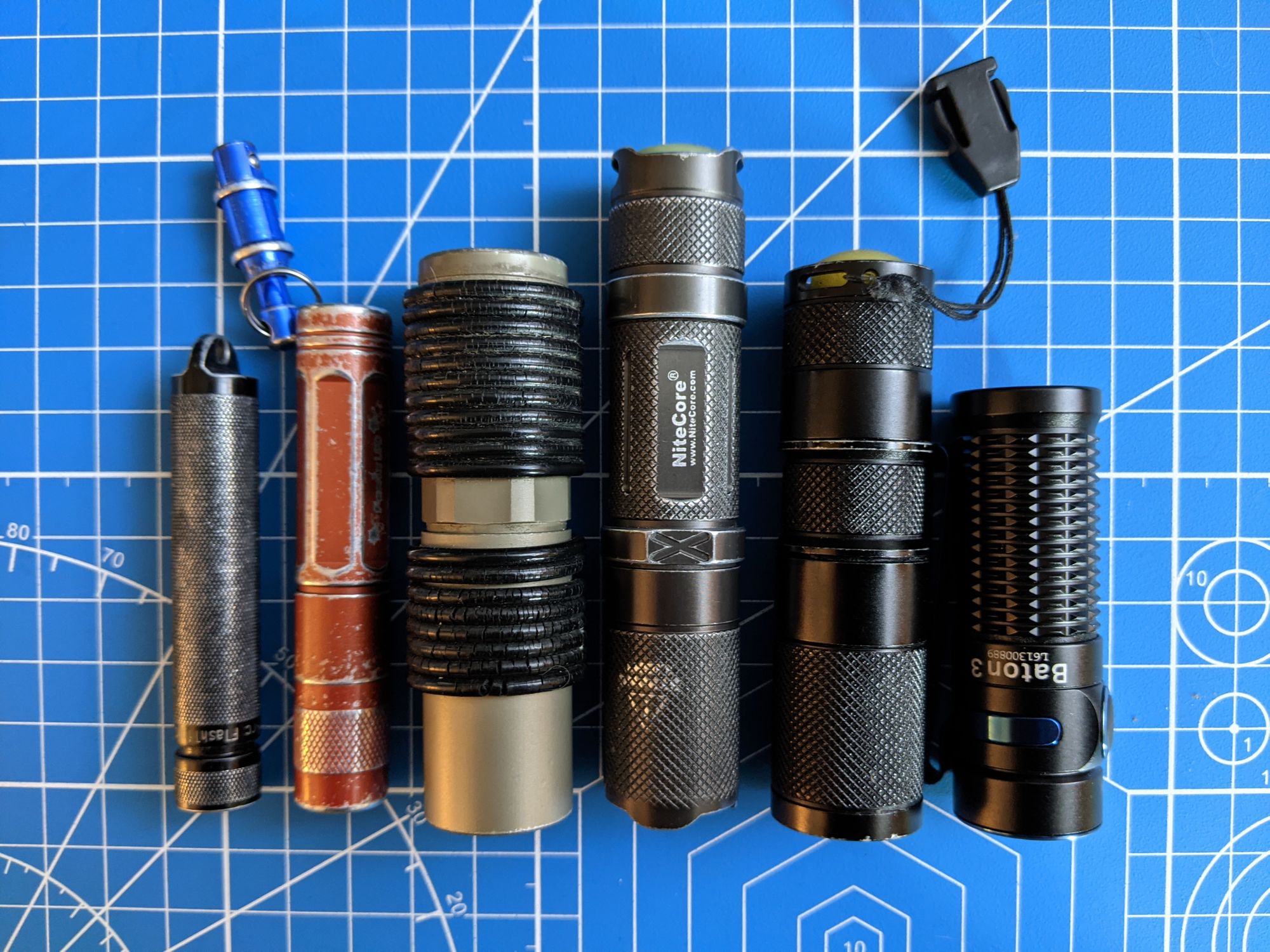 Arc AAA, Fenix L0D, Fenix P2D, Nitecore Defender Infinity, Quark 123, OLight Baton 3